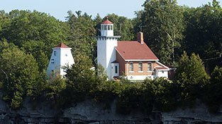 Sherwood lighthouse surrounded by trees.