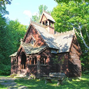 A wooden chapel in the woods.