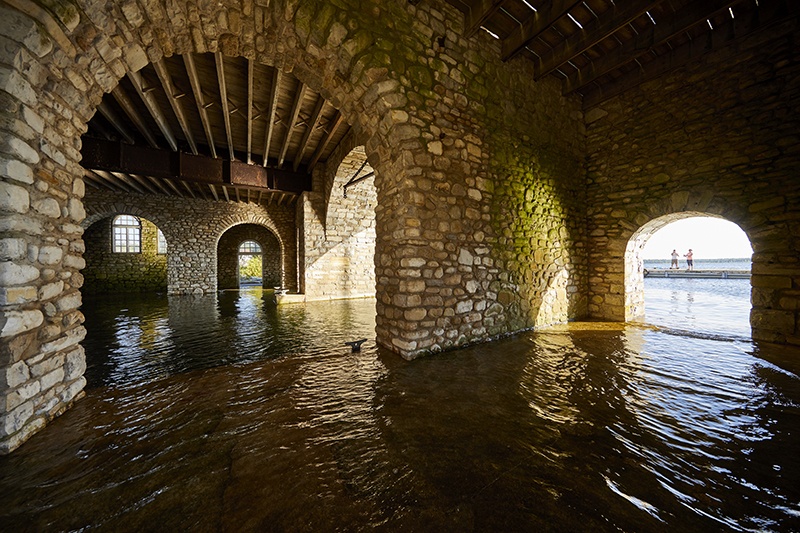 Several stone archways with water passing through