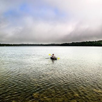 A solo kayaker in the lake