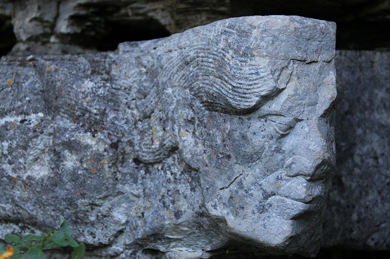 A face carved into a piece of stone