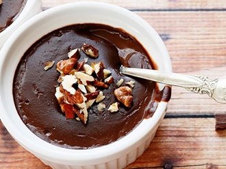 A spoon in a chocolate pots de creme