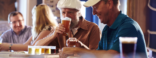 People enjoying beer at a tavern.