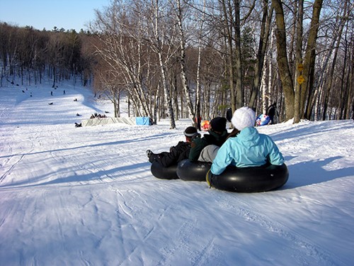 Kids sled on the very steep Hill 17.