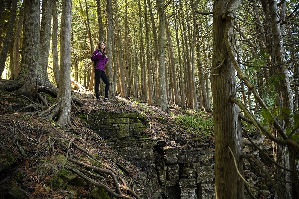 Woman hiking through woods
