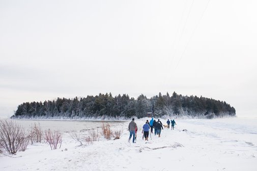 Group hiking through the snow