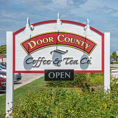 Sign that says Door County Coffee & Tea Co. Open
