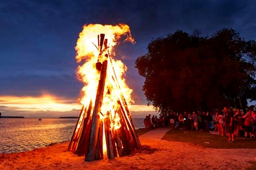 A sunset bonfire during Fyr Bal.