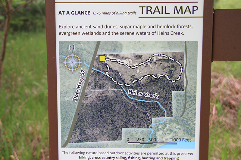 A colorful and detailed trail map at the preserve.