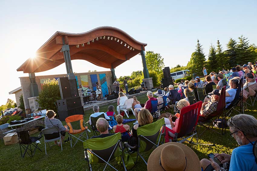 A large crowd enjoys a concert at the Sunset Concert Series.