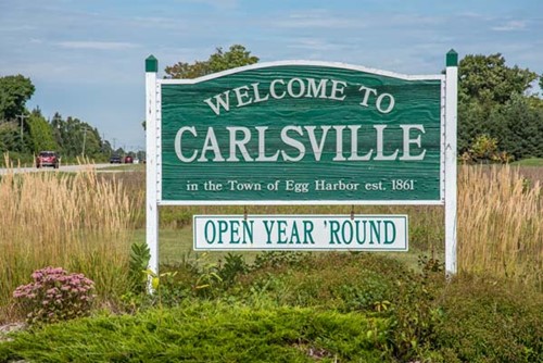 A "Welcome" sign at the Carlsville town border.