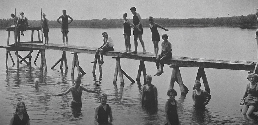 Vintage shot of visitors swimming in the lake