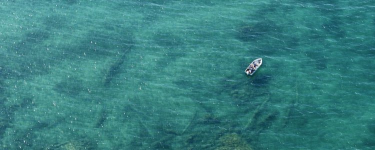 A boat out on the lake from the air.