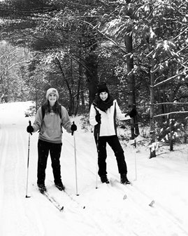 A couple cross country skiing