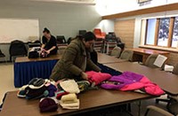 People preparing clothing for the Big Bundle Up in 2018.