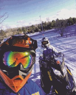 Snowmobilers taking a selfie.