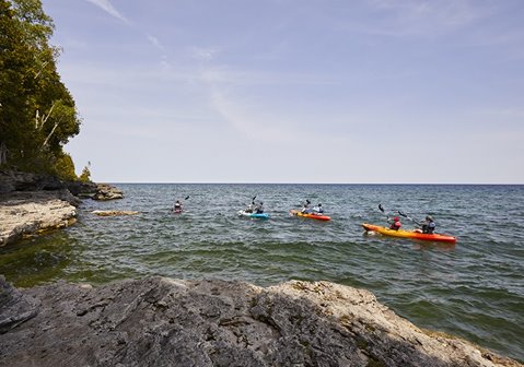 A group of kayakers on the lake