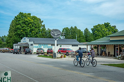 Two people biking on a road