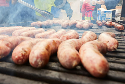 Closeup of brats on a grill