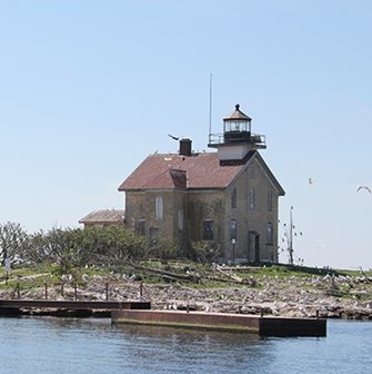 A lighthouse at the edge of the lake.