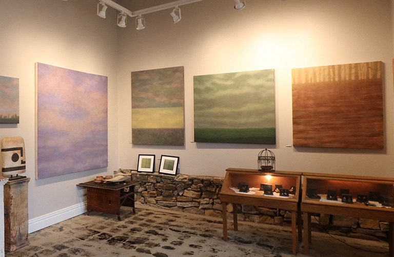 Abstract paintings hang in art gallery
