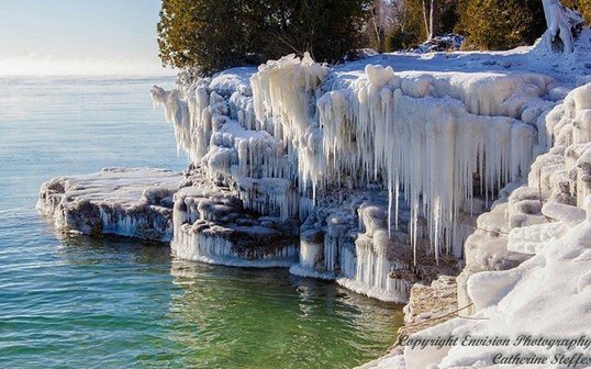 Ice-covered rocks at the lakefront.