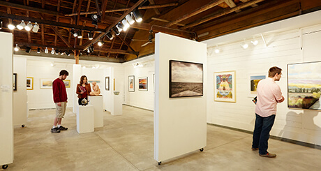 People looking at art at an art gallery.