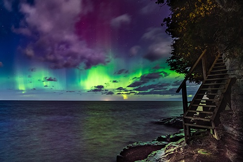 Bright green Northern Lights over Lake Michigan.