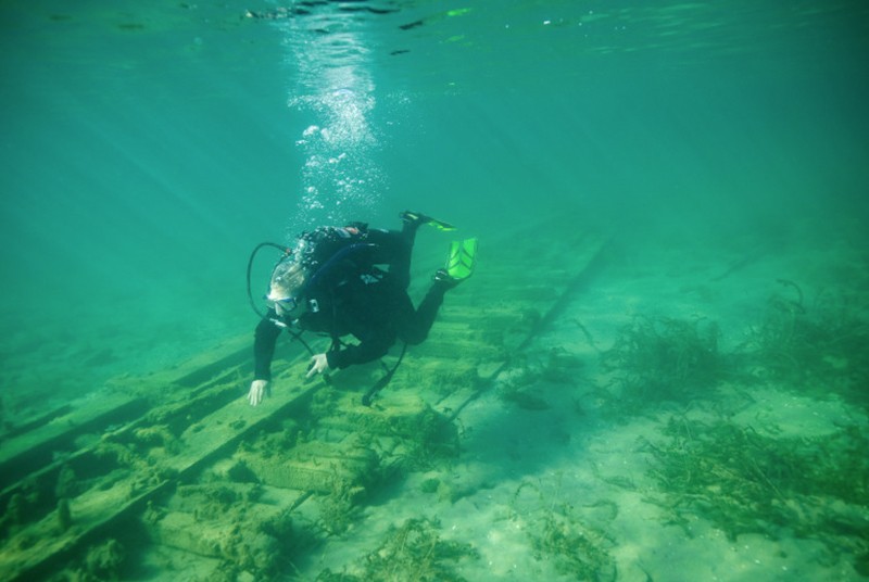 Scuba diver diving around a shipwreck