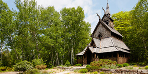 Wooden building wedding venue surrounded by trees