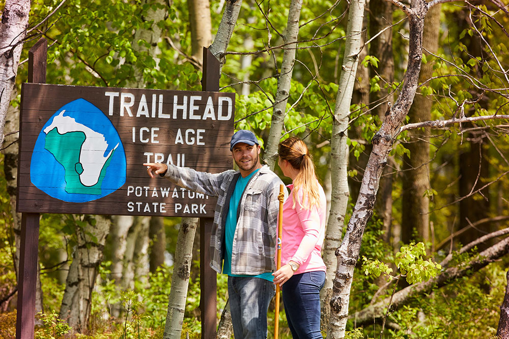 People standing near the entrance of the Ice Age trailhead