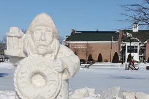 Snow carving of a boat captain.