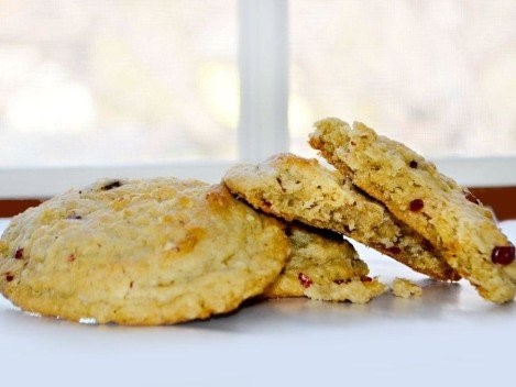 A stack of granola cookies with a bite out of one