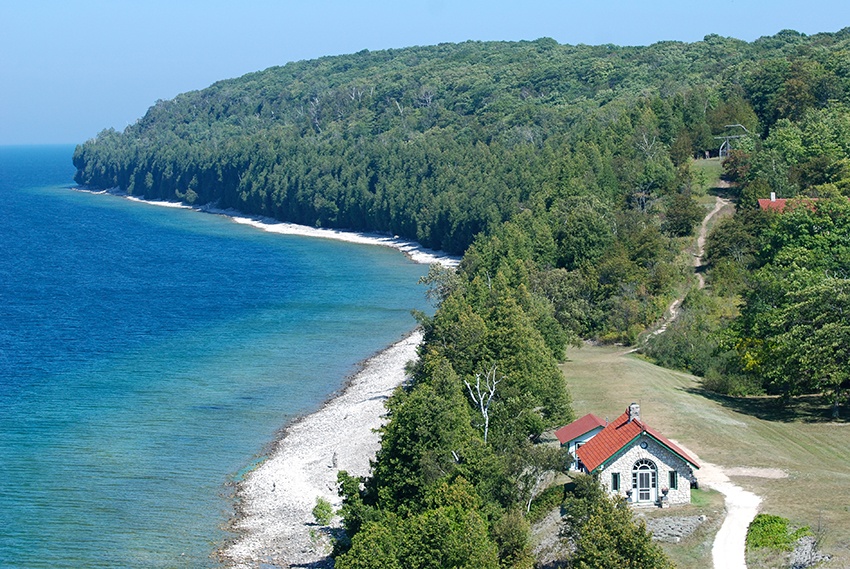 Aerial view of Rock Island shoreline with view of a vintage outbuilding