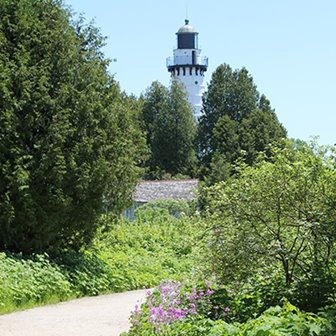 A path leading up to a white lighthouse.