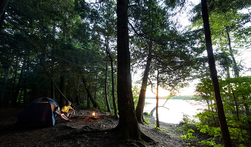 A couple backpack camps at a remote campsite at Newport State Park