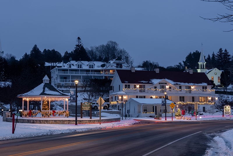 Downtown Ephraim covered in snow with holiday lights aglow