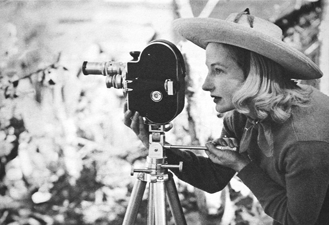 Madeline Tourtelot behind a vintage film camera