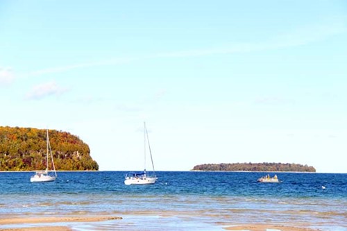 Community Spotlight: Ephraim Sailboats in Eagle Harbor on a sunny day.