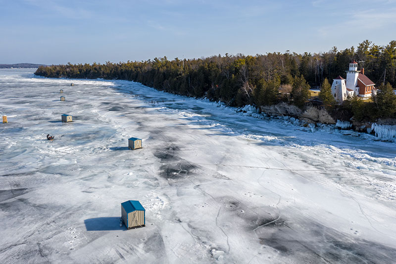 Ice Fishing in Door County Sherwood Point Lighthouse winter aerials.