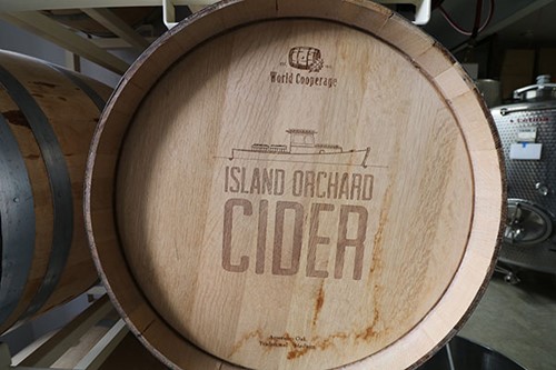 Community Spotlight: Ellison Bay A rustic barrel imprinted with the Island Orchard logo at the cidery.