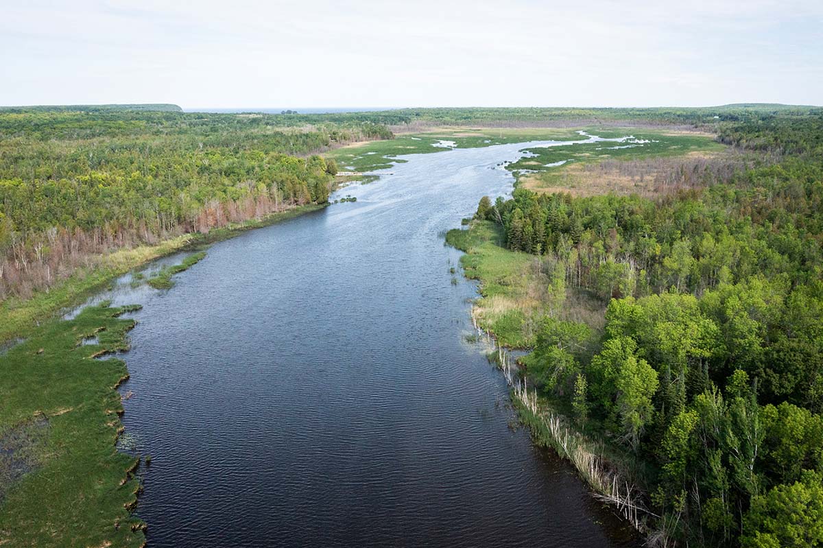 Lakes & Waterways Photo Tour A view down the Mink River as it feeds toward Lake Michigan.