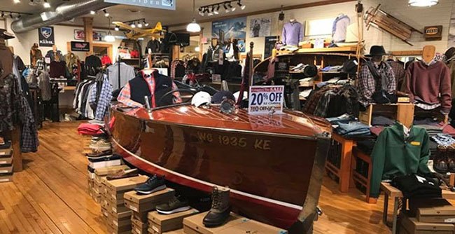 Where to Get Winter Gear & Clothing Interior of an On Deck store with warm woods and high-end clothing