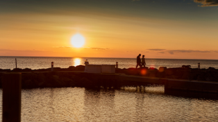 Community Visitor Centers Couple standing by Sister Bay
