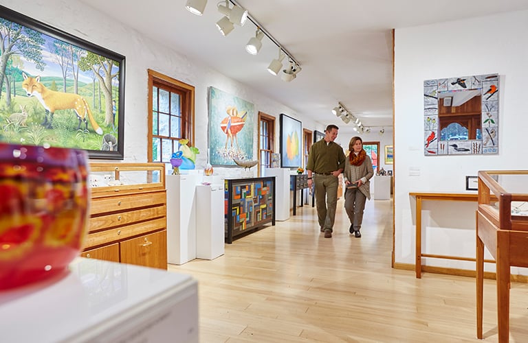 Interior of a Door County art gallery with paintings on display