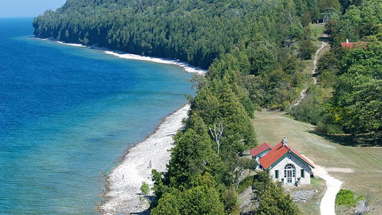 Nature Preserves & Conservation A house on the lake at the edge of the woods.