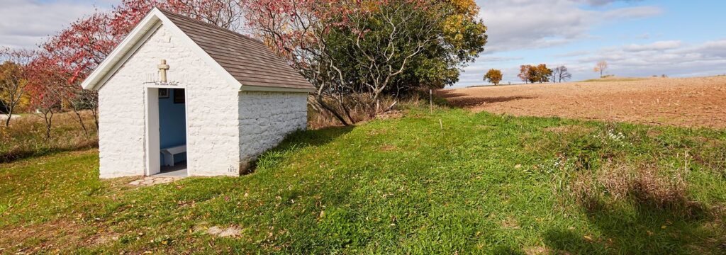 A small white stone chapel
