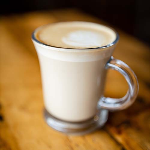 Latte in a glass mug.