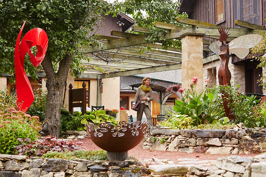 Arts & Culture A person walking through a garden.