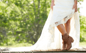 Weddings Woman in wedding dress showing her boots.